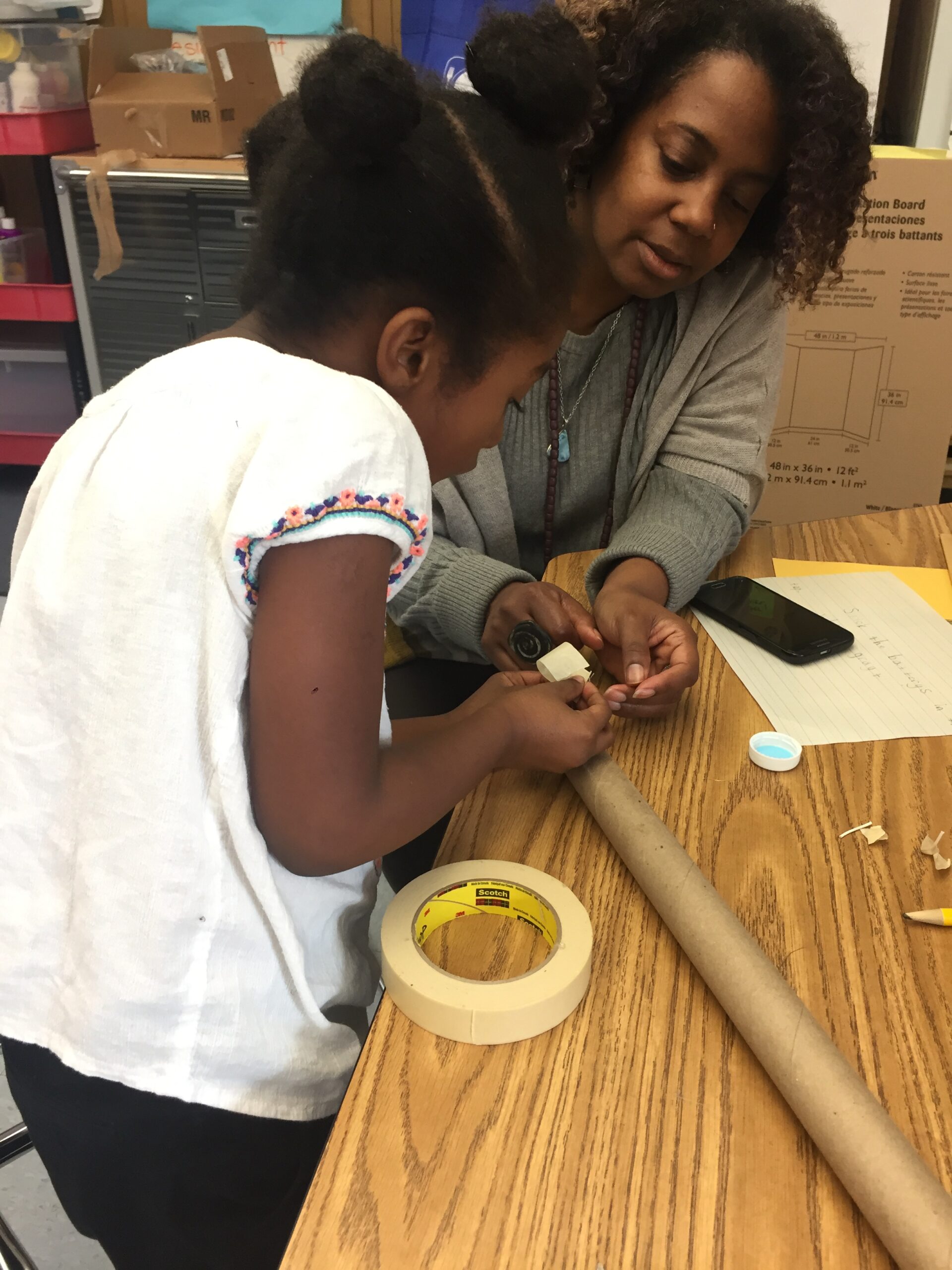 Paula works with a first grader on her self-designed project in Grass Valley Elementary’s Wonder Workshop.