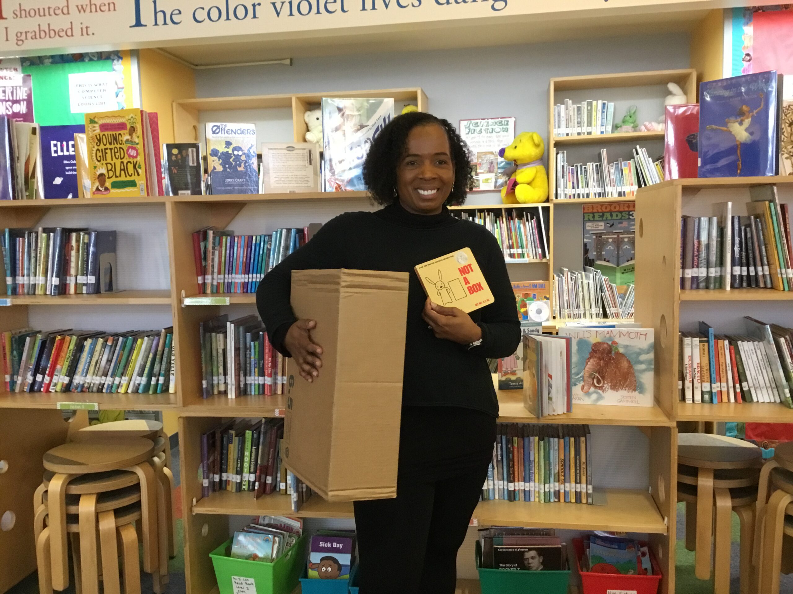 A photo of Ms. White Dressing Up for Character Day as “Not A Box!”